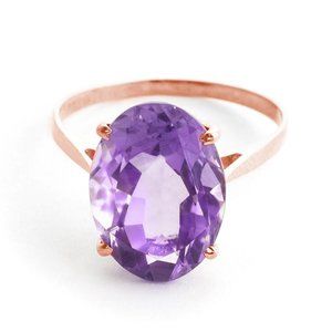 14K. SOLID GOLD RING WITH NATURAL OVAL AMETHYST